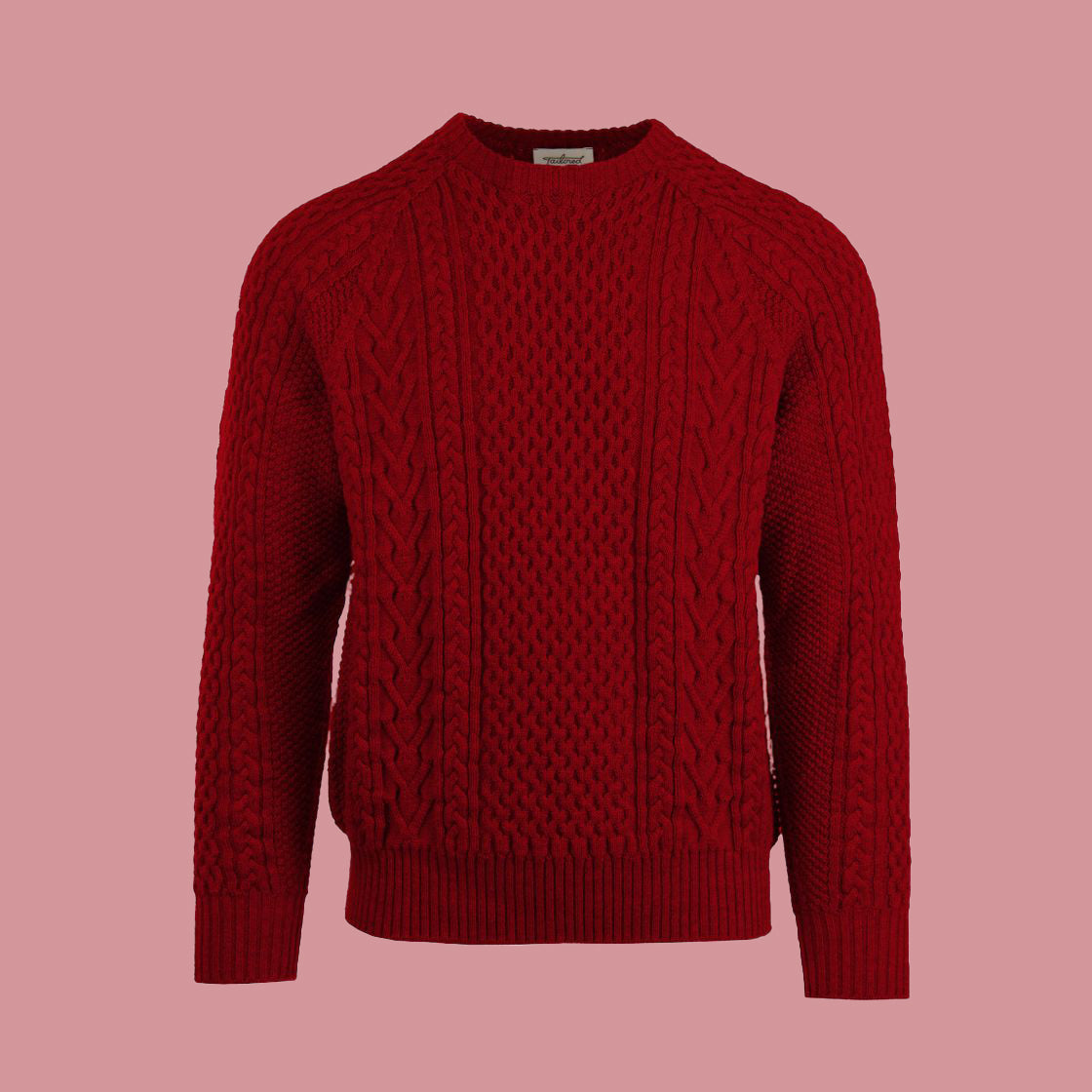 A cable-knit sweater in a red cherry color