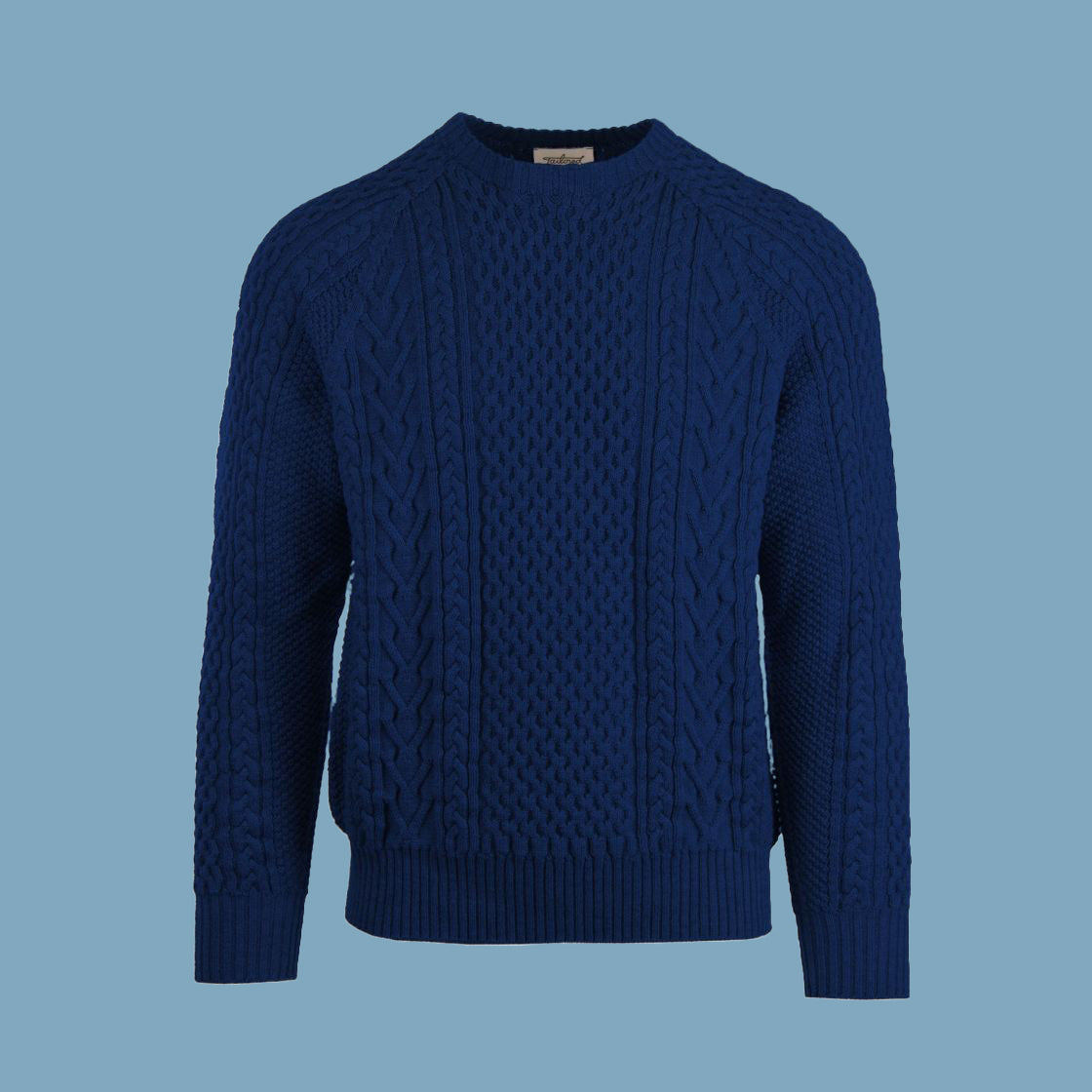 A cable-knit sweater in a royal blue color