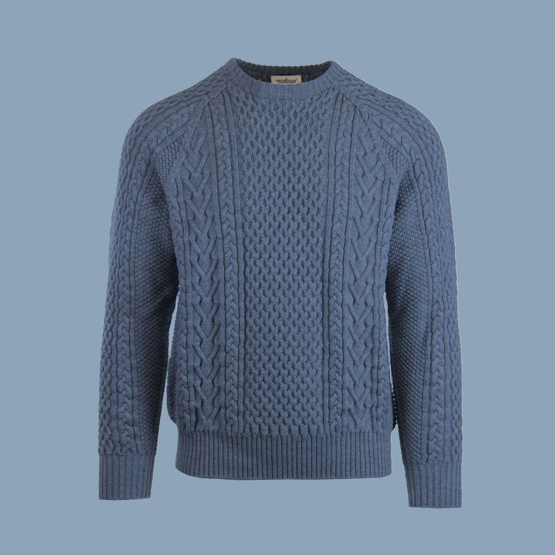 A cable-knit sweater in a light blue color