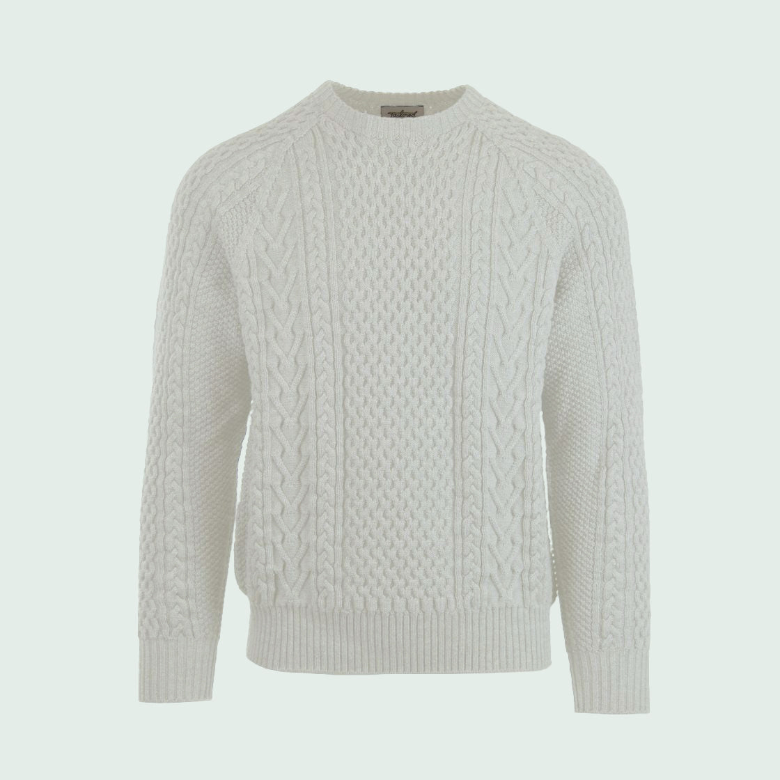 A cable-knit sweater in a light gray color