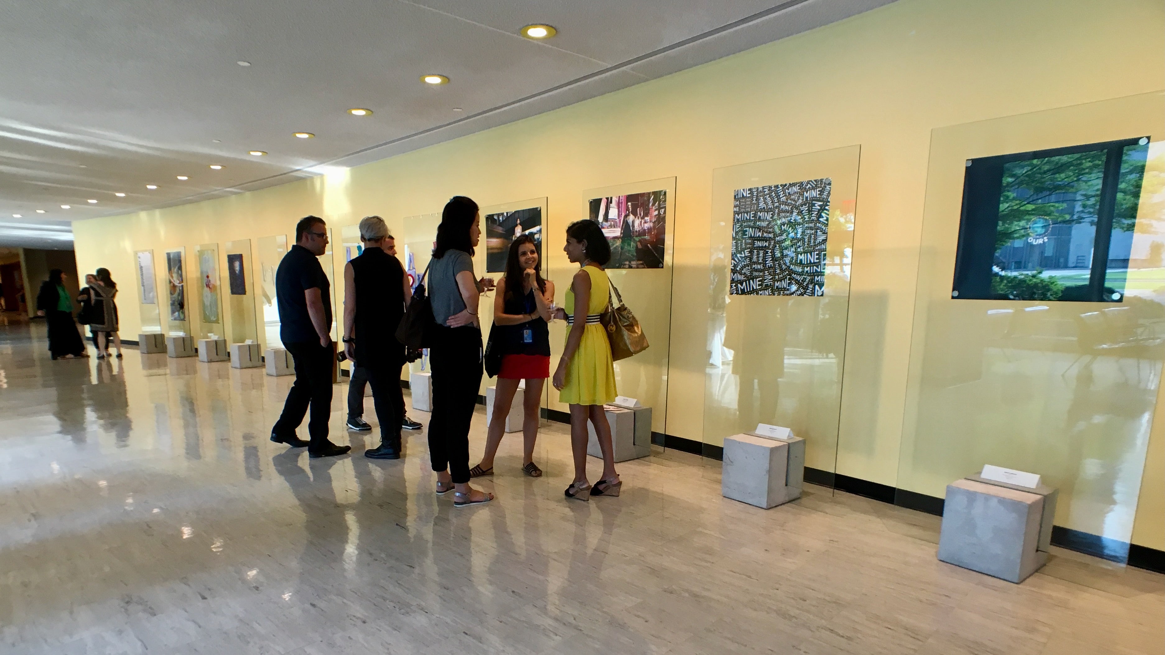 People gathered at an art exhibit