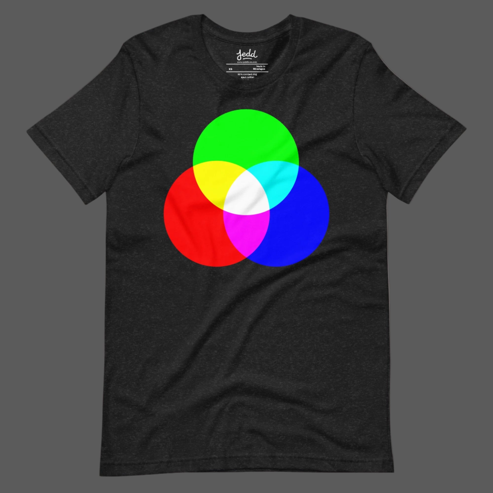 A dark heather gray t-shirt with RGB circles creating white light in the center.