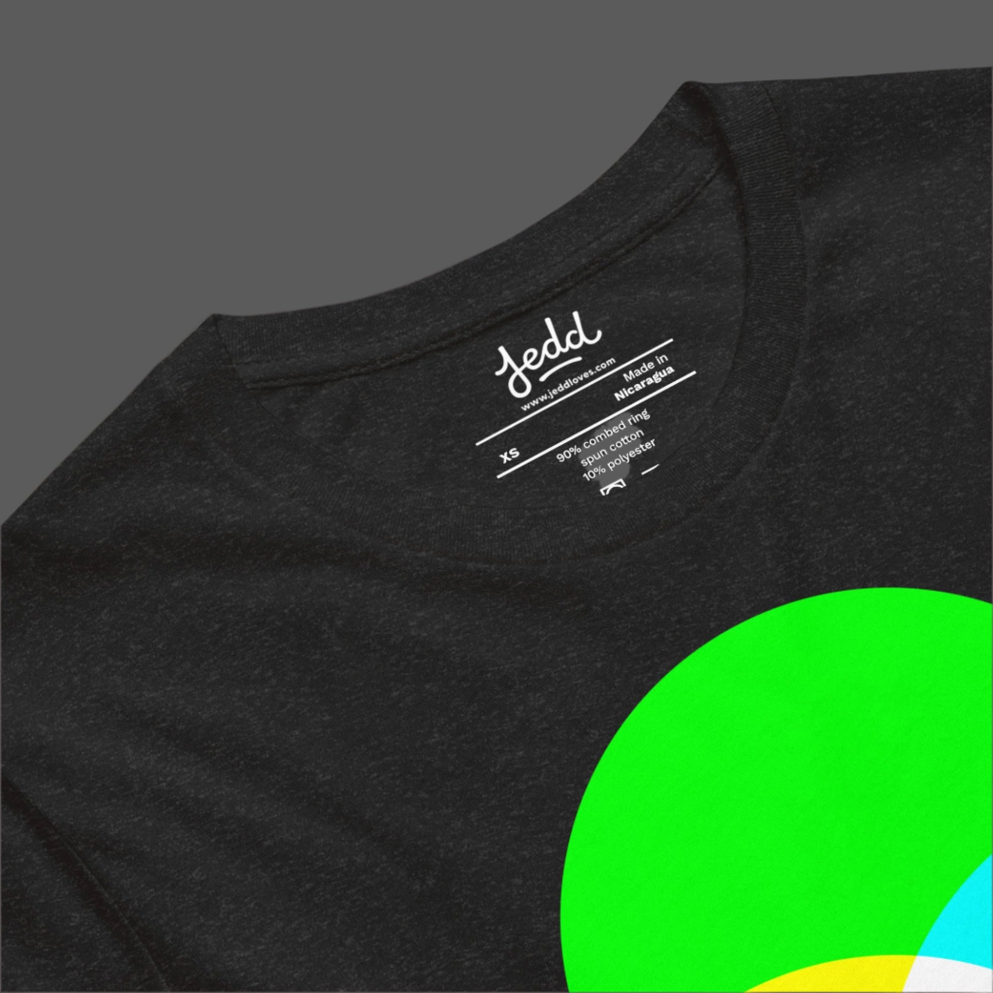 A dark heather gray t-shirt with RGB circles creating white light in the center.