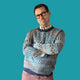 Jedd wearing a blue sweater with geometric patterns.