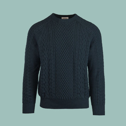 A cable-knit sweater in a deep blue marine color