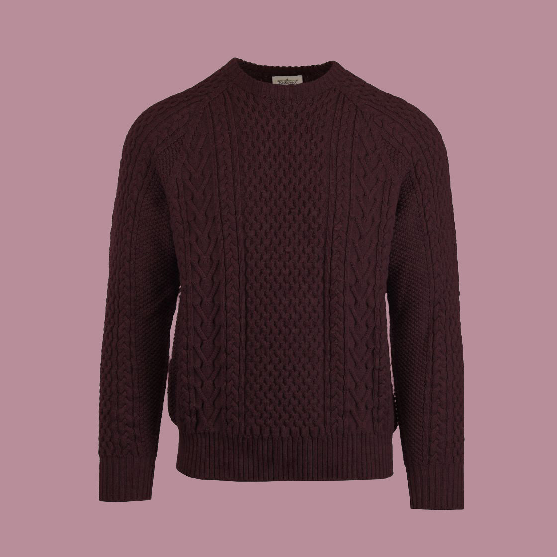 A cable-knit sweater in a dark red color