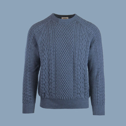 A cable-knit sweater in a light blue color