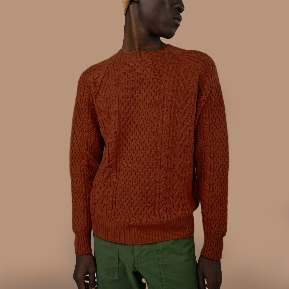 A cable-knit sweater