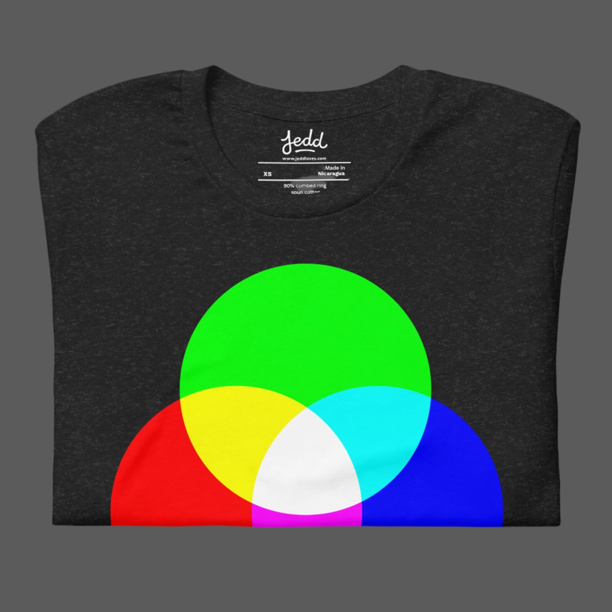 A dark heather gray t-shirt with RGB circles creating white light in the center.